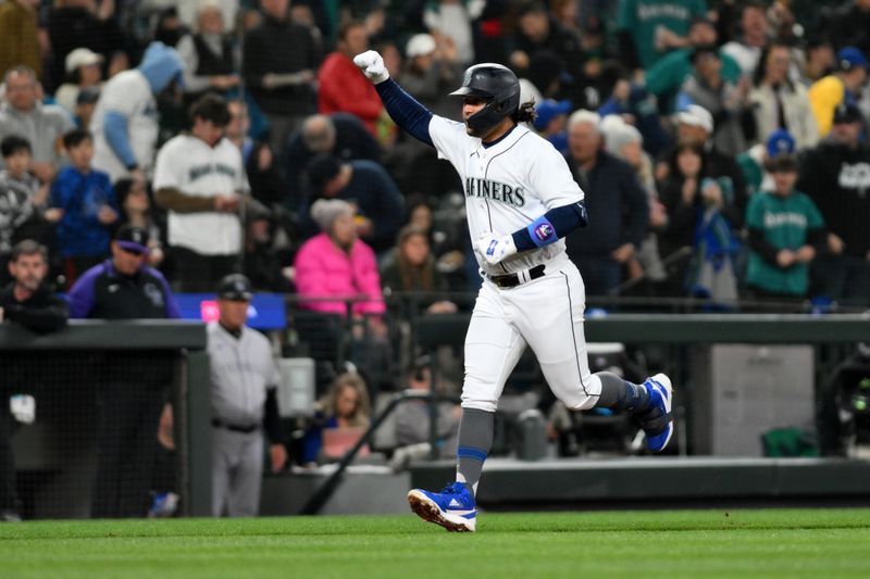 Apr 15, 2023; Seattle, Washington, USA; Seattle Mariners third baseman Eugenio Suarez (28) celebrates after hitting a home run against the Colorado Rockies during the fourth inning at T-Mobile Park. Mandatory Credit: Steven Bisig-USA TODAY Sports