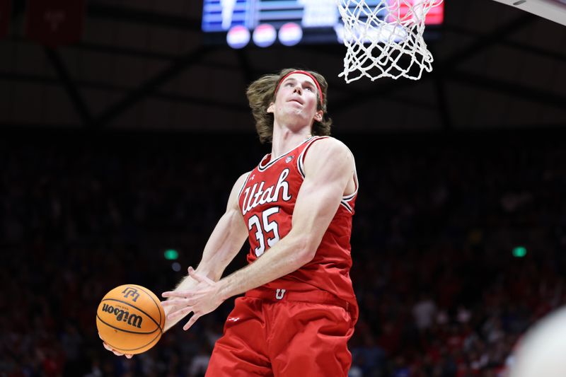 Dec 9, 2023; Salt Lake City, Utah, USA; Utah Utes center Branden Carlson (35) dunks the ball against the Brigham Young Cougars during the second half at Jon M. Huntsman Center. Mandatory Credit: Rob Gray-USA TODAY Sports