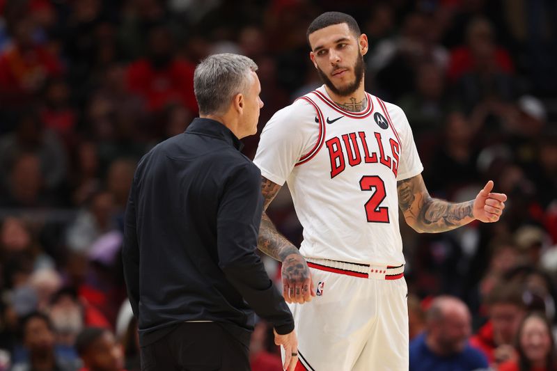 CHICAGO, ILLINOIS - OCTOBER 16: Head coach Billy Donovan of the Chicago Bulls talks with Lonzo Ball #2 against the Minnesota Timberwolves during the second half of a preseason game at the United Center on October 16, 2024 in Chicago, Illinois. NOTE TO USER: User expressly acknowledges and agrees that, by downloading and or using this photograph, User is consenting to the terms and conditions of the Getty Images License Agreement.  (Photo by Michael Reaves/Getty Images)