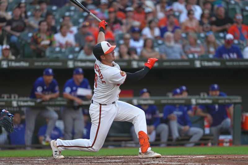 Jun 27, 2024; Baltimore, Maryland, USA; Baltimore Orioles first baseman Ryan Mountcastle (6) drives in a run on his sacrifice fly ball in the third inning against the Texas Rangers at Oriole Park at Camden Yards. Mandatory Credit: Mitch Stringer-USA TODAY Sports