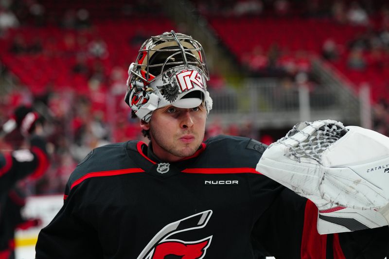 Nov 3, 2024; Raleigh, North Carolina, USA;  Carolina Hurricanes goaltender Pyotr Kochetkov (52) looks on before the game during the warmups against the Washington Capitals at Lenovo Center. Mandatory Credit: James Guillory-Imagn Images