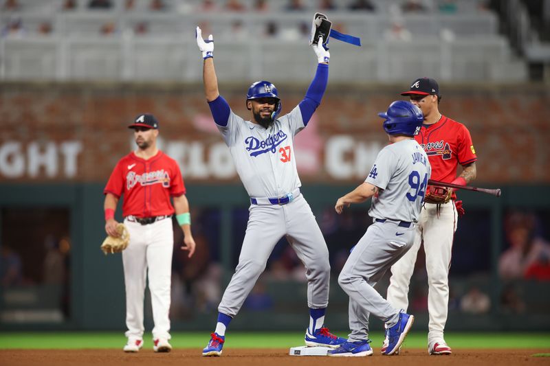 Sep 13, 2024; Atlanta, Georgia, USA; Los Angeles Dodgers left fielder Teoscar Hernandez (37) celebrates after a double against the Atlanta Braves in the fourth inning at Truist Park. Mandatory Credit: Brett Davis-Imagn Images