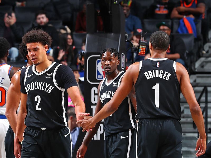 BROOKLYN, NY - JANUARY 23: Mikal Bridges #1 and Cameron Johnson #2 of the Brooklyn Nets high five during the game against the New York Knicks on January 23, 2024 at Barclays Center in Brooklyn, New York. NOTE TO USER: User expressly acknowledges and agrees that, by downloading and or using this Photograph, user is consenting to the terms and conditions of the Getty Images License Agreement. Mandatory Copyright Notice: Copyright 2024 NBAE (Photo by David L. Nemec/NBAE via Getty Images)