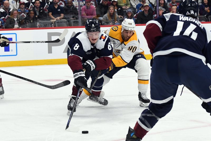 Nov 11, 2024; Denver, Colorado, USA; Colorado Avalanche defenseman Cale Makar (8) works to take the puck from Nashville Predators center Ryan O'Reilly (90) during the third period at Ball Arena. Mandatory Credit: Christopher Hanewinckel-Imagn Images