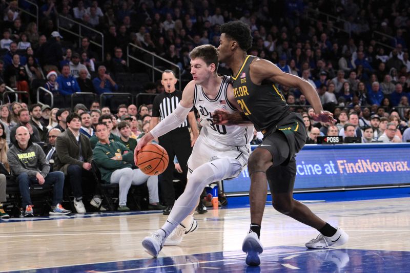 Dec 20, 2023; New York, New York, USA; Duke Blue Devils center Kyle Filipowski (30) drives to the basket as Baylor Bears center Yves Missi (21) defends during the first half at Madison Square Garden. Mandatory Credit: John Jones-USA TODAY Sports