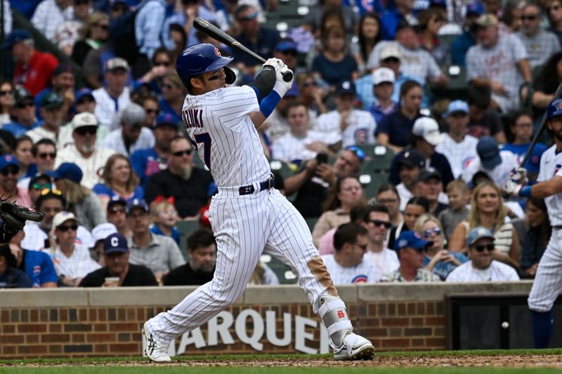 Sep 24, 2023; Chicago, Illinois, USA;  Chicago Cubs right fielder Seiya Suzuki (27) hits a double against the Colorado Rockies during the sixth inning at Wrigley Field. Mandatory Credit: Matt Marton-USA TODAY Sports