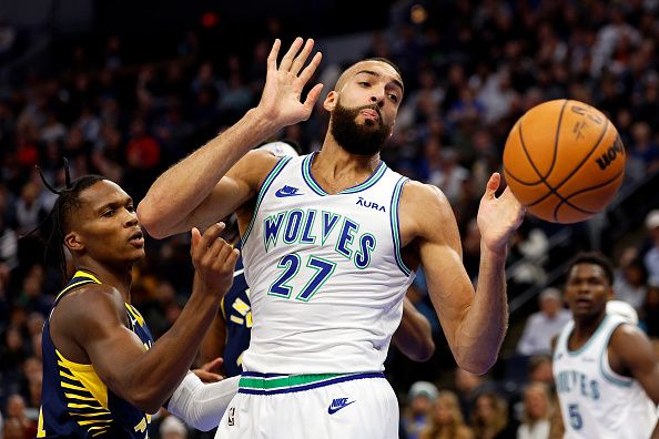 MINNEAPOLIS, MINNESOTA - DECEMBER 16: Bennedict Mathurin #00 of the Indiana Pacers (L) and Rudy Gobert #27 of the Minnesota Timberwolves compete for the rebound in the second quarter at Target Center on December 16, 2023 in Minneapolis, Minnesota. NOTE TO USER: User expressly acknowledges and agrees that, by downloading and or using this photograph, User is consenting to the terms and conditions of the Getty Images License Agreement. (Photo by David Berding/Getty Images)