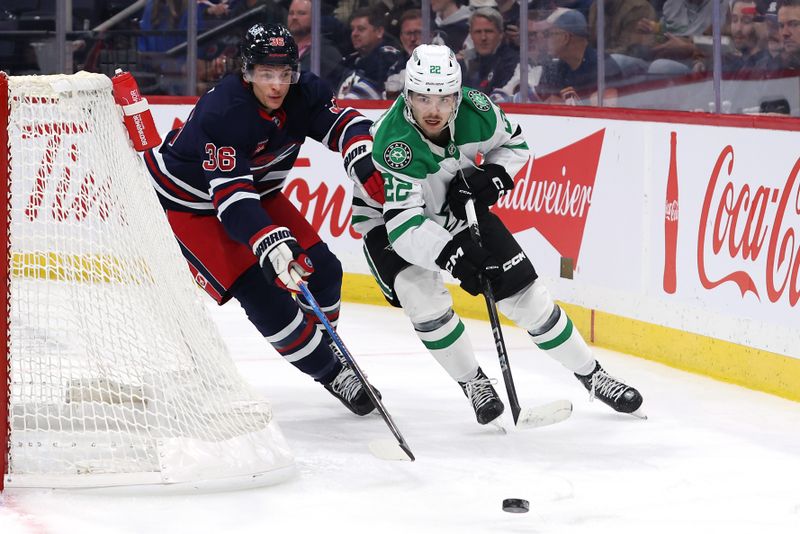 Nov 9, 2024; Winnipeg, Manitoba, CAN; Dallas Stars center Mavrik Bourque (22) is chased down by Winnipeg Jets center Morgan Barron (36) in the second period at Canada Life Centre. Mandatory Credit: James Carey Lauder-Imagn Images