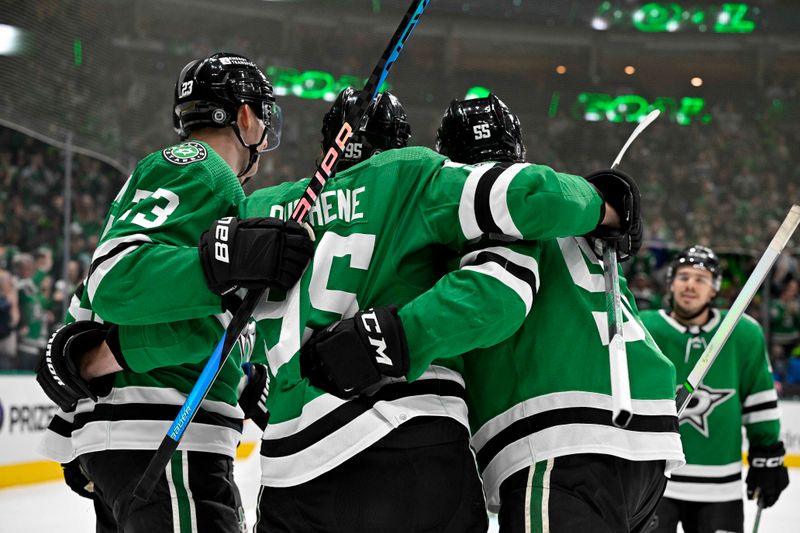 Feb 26, 2024; Dallas, Texas, USA; Dallas Stars defenseman Esa Lindell (23) and center Matt Duchene (95) and center Wyatt Johnston (53) and center Logan Stankoven (11) celebrates a goal scored by Duchene against the New York Islanders during the second period at the American Airlines Center. Stankoven scores his first career NHL point. Mandatory Credit: Jerome Miron-USA TODAY Sports