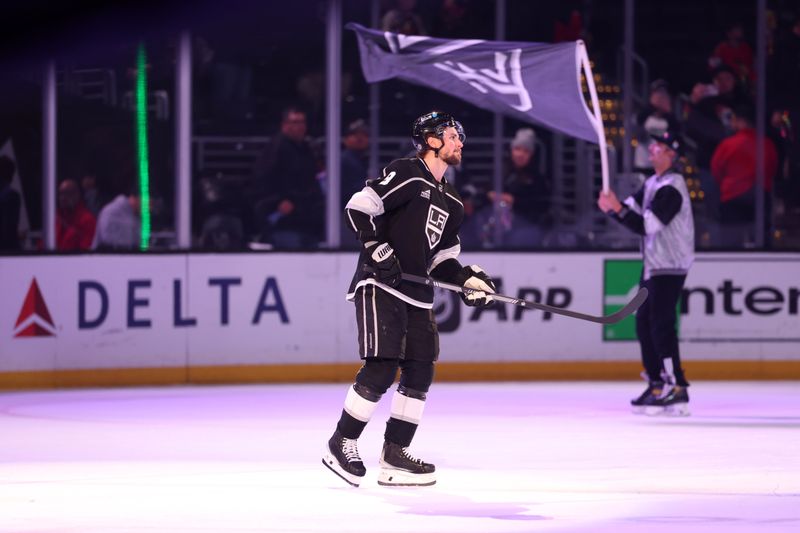 Mar 19, 2024; Los Angeles, California, USA;  Los Angeles Kings right wing Adrian Kempe (9) celebrates a win against the Chicago Blackhawks at Crypto.com Arena. Mandatory Credit: Kiyoshi Mio-USA TODAY Sports