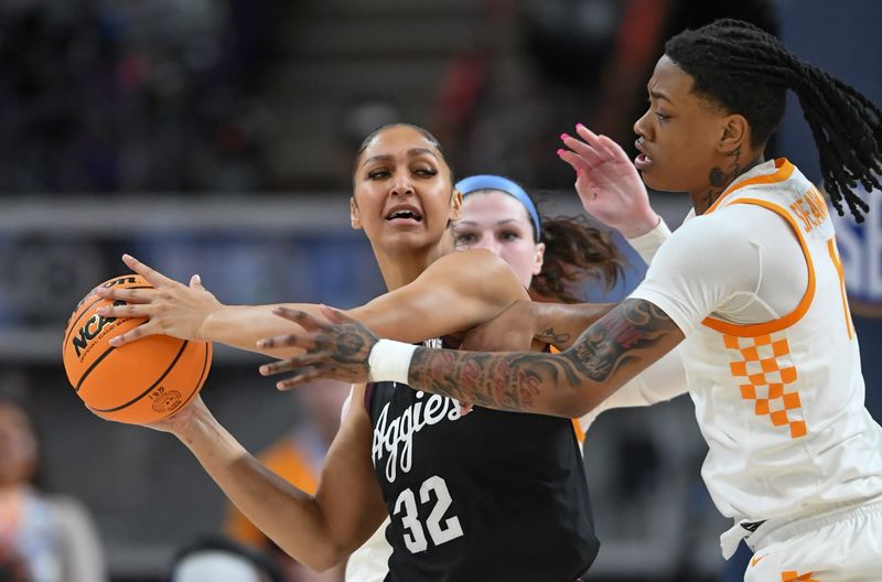 Mar 5, 2025; Greenville, South Carolina, USA; Texas A&M forward Lauren Ware (32) looks to pass near Tennessee forward Zee Spearman (11) during the first quarter of the Southeastern Conference Women's Basketball Tournament at Bon Secours Wellness Arena.  Mandatory Credit: Ken Ruinard/USA TODAY NETWORK via Imagn Images