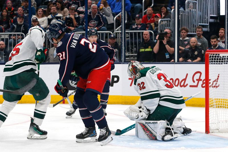 Oct 19, 2024; Columbus, Ohio, USA; Minnesota Wild goalie Filip Gustavsson (32) makes a save against the Columbus Blue Jackets during the second period at Nationwide Arena. Mandatory Credit: Russell LaBounty-Imagn Images