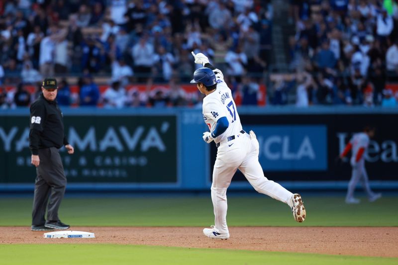 May 17, 2024; Los Angeles, California, USA;  Los Angeles Dodgers designated hitter Shohei Ohtani (17) reacts after hitting a home run during the third inning against the Cincinnati Reds at Dodger Stadium. Mandatory Credit: Kiyoshi Mio-USA TODAY Sports