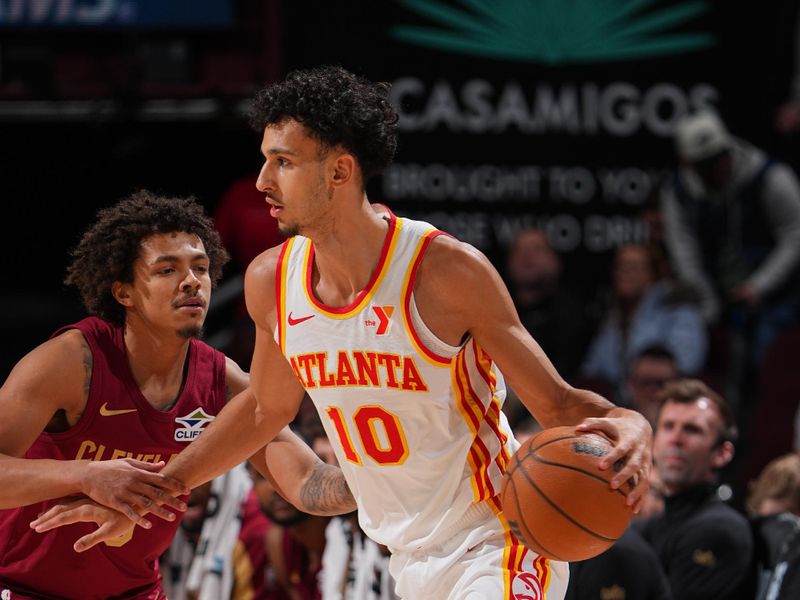 CLEVELAND, OH - JANUARY 30:  Zaccharie Risacher #10 of the Atlanta Hawks dribbles the ball during the game against the Cleveland Cavaliers on January 30, 2025 at Rocket Mortgage FieldHouse in Cleveland, Ohio. NOTE TO USER: User expressly acknowledges and agrees that, by downloading and/or using this Photograph, user is consenting to the terms and conditions of the Getty Images License Agreement. Mandatory Copyright Notice: Copyright 2025 NBAE (Photo by Garrett Ellwood/NBAE via Getty Images)