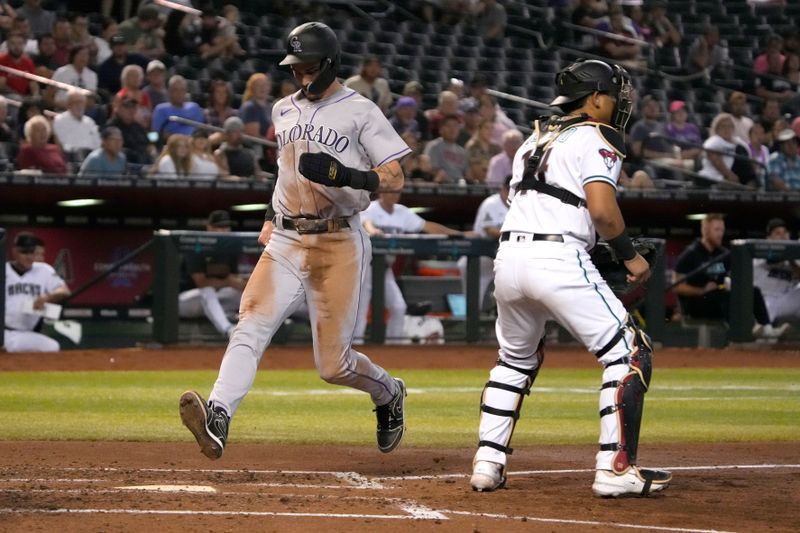 Sep 5, 2023; Phoenix, Arizona, USA; Colorado Rockies center fielder Brenton Doyle (9) scores a run against the Arizona Diamondbacks in the fourth inning at Chase Field. Mandatory Credit: Rick Scuteri-USA TODAY Sports