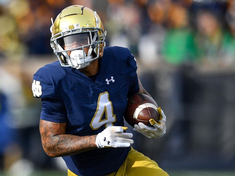 Oct 28, 2023; South Bend, Indiana, USA; Notre Dame Fighting Irish wide receiver Chris Tyree (4) carries against the Pittsburgh Panthers in the first quarter at Notre Dame Stadium. Mandatory Credit: Matt Cashore-USA TODAY Sports