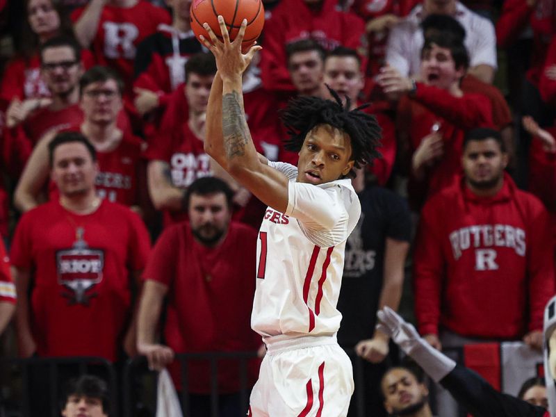 Feb 10, 2024; Piscataway, New Jersey, USA; Rutgers Scarlet Knights guard Jamichael Davis (1) rebounds against the Wisconsin Badgers during the second half at Jersey Mike's Arena. Mandatory Credit: Vincent Carchietta-USA TODAY Sports