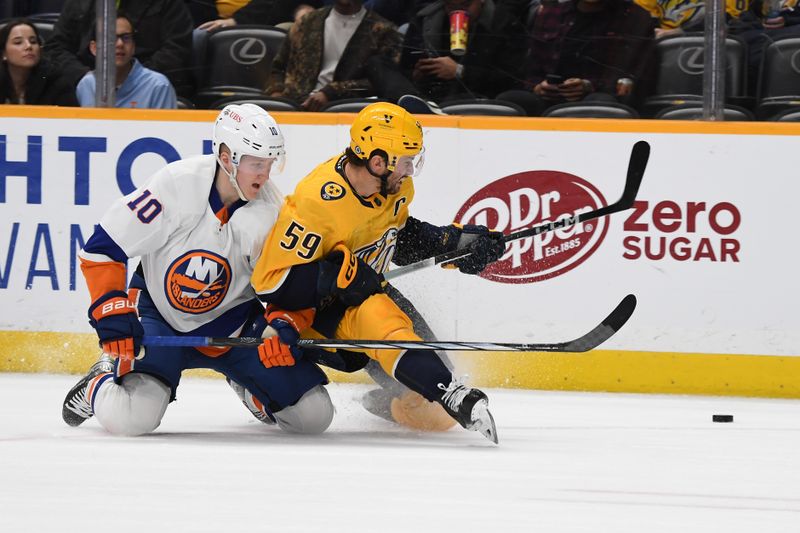 Jan 13, 2024; Nashville, Tennessee, USA; Nashville Predators defenseman Roman Josi (59) is taken down by New York Islanders right wing Simon Holmstrom (10) as he plays the puck during the second period at Bridgestone Arena. Mandatory Credit: Christopher Hanewinckel-USA TODAY Sports