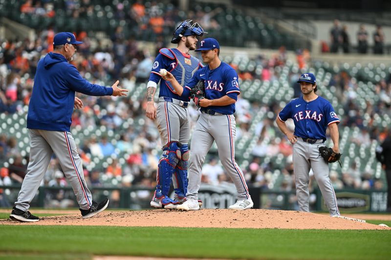 Apr 18, 2024; Detroit, Michigan, USA;  Texas Rangers starting pitcher Jack Leiter (35) hands the ball to manager Bruce Bochy after being pulled from the game in his Major League debut against the Detroit Tigers in the fourth inning at Comerica Park. Mandatory Credit: Lon Horwedel-USA TODAY Sports