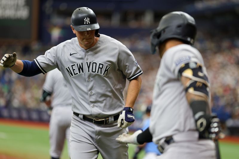 Aug 27, 2023; St. Petersburg, Florida, USA;  New York Yankees first baseman DJ LeMahieu (26) celebrates with second baseman Gleyber Torres (25) after hitting home run against the Tampa Bay Rays in the third inning  at Tropicana Field. Mandatory Credit: Nathan Ray Seebeck-USA TODAY Sports