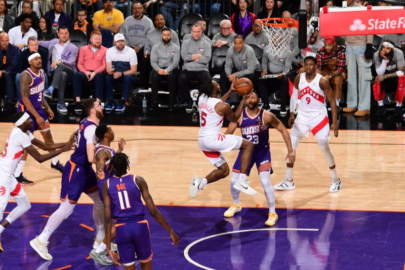 PHOENIX, AZ - MARCH 7: Immanuel Quickley #5 of the Toronto Raptors drives to the basket during the game against the Phoenix Suns on March 7, 2024 at Footprint Center in Phoenix, Arizona. NOTE TO USER: User expressly acknowledges and agrees that, by downloading and or using this photograph, user is consenting to the terms and conditions of the Getty Images License Agreement. Mandatory Copyright Notice: Copyright 2024 NBAE (Photo by Kate Frese/NBAE via Getty Images)