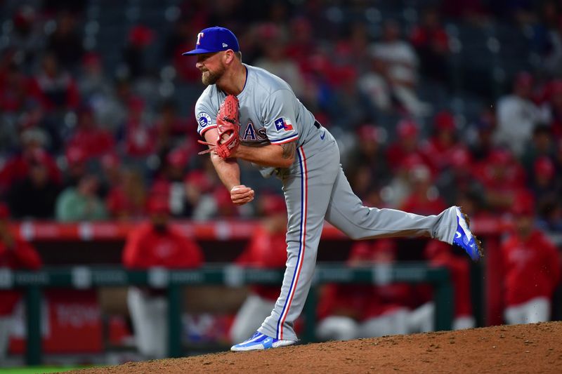 Sep 27, 2024; Anaheim, California, USA; Texas Rangers pitcher Kirby Yates (39) throws against the Los Angeles Angels during the ninth inning at Angel Stadium. Mandatory Credit: Gary A. Vasquez-Imagn Images