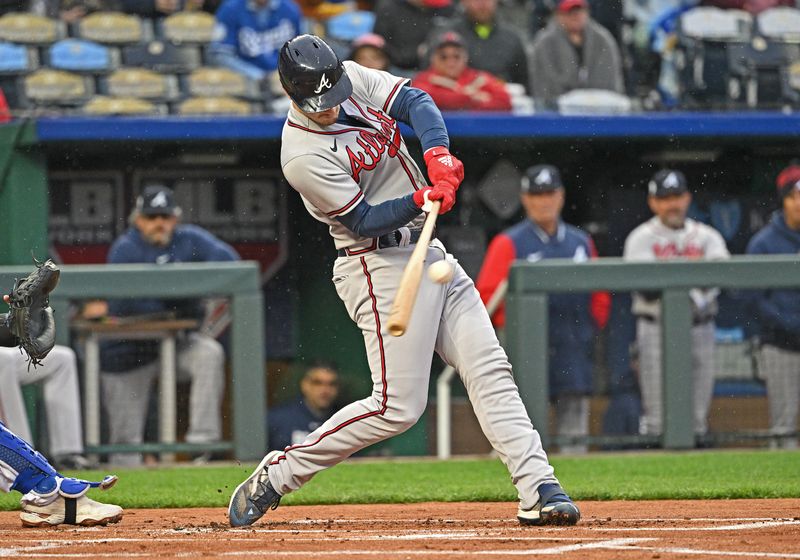 Apr 15, 2023; Kansas City, Missouri, USA;  Atlanta Braves catcher Sean Murphy (12) hits an RBI double during the first inning against the Kansas City Royals at Kauffman Stadium. Mandatory Credit: Peter Aiken-USA TODAY Sports