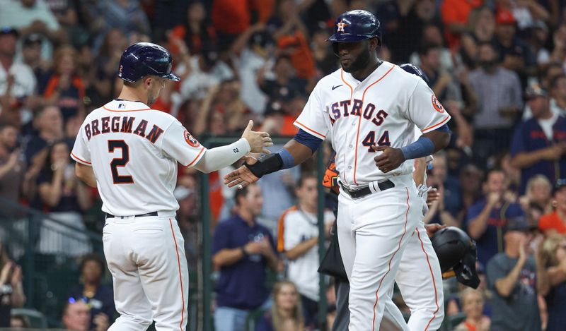 Aug 12, 2023; Houston, Texas, USA; Houston Astros designated hitter Yordan Alvarez (44) celebrates with third baseman Alex Bregman (2) after scoring a run during the fifth inning against the Los Angeles Angels at Minute Maid Park. Mandatory Credit: Troy Taormina-USA TODAY Sports