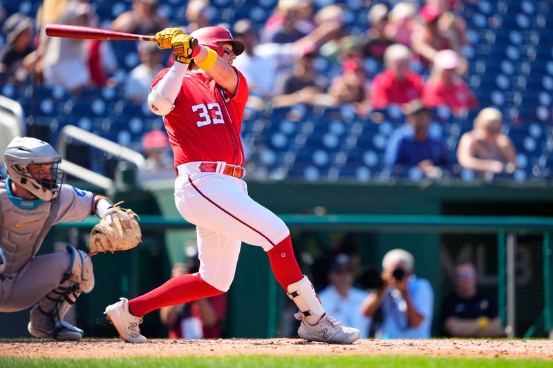 Sep 3, 2023; Washington, District of Columbia, USA;  Washington Nationals second baseman Travis Blankenhorn (33) hits a single against the Miami Marlins during the fourth inning at Nationals Park. Mandatory Credit: Gregory Fisher-USA TODAY Sports