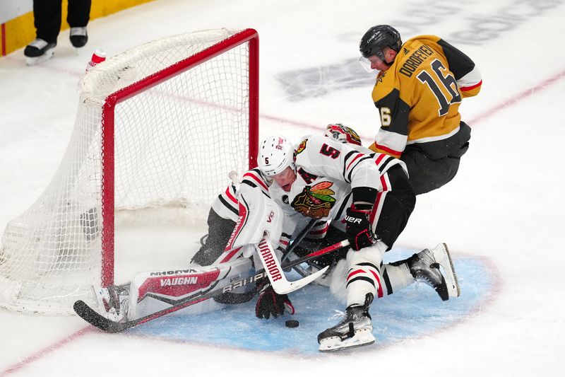 Apr 16, 2024; Las Vegas, Nevada, USA; Chicago Blackhawks defenseman Connor Murphy (5) attempts to clear the puck after Chicago Blackhawks goaltender Petr Mrazek (34) made a save against Vegas Golden Knights left wing Pavel Dorofeyev (16) during the second period at T-Mobile Arena. Mandatory Credit: Stephen R. Sylvanie-USA TODAY Sports