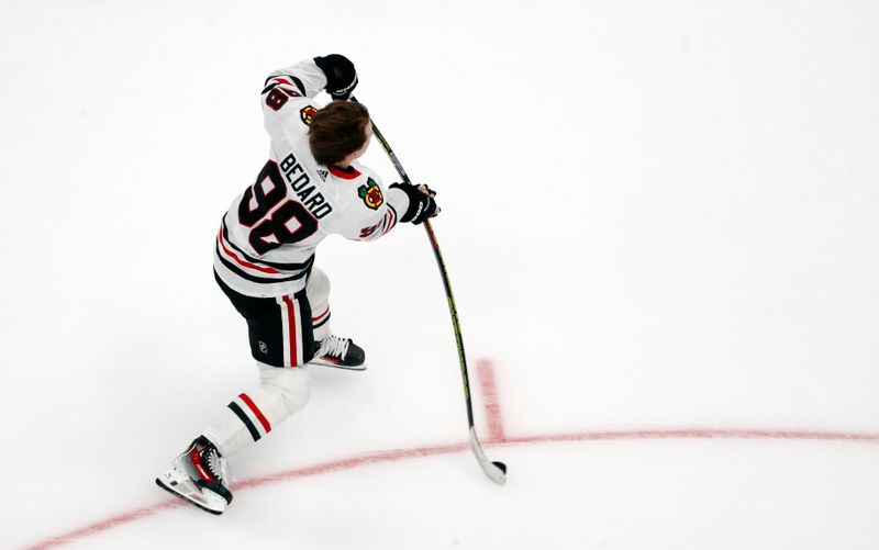 Oct 10, 2023; Pittsburgh, Pennsylvania, USA; Chicago Blackhawks center Connor Bedard (98) warms up before making his NHL debut against the Pittsburgh Penguins at the PPG Paints Arena. Mandatory Credit: Charles LeClaire-USA TODAY Sports