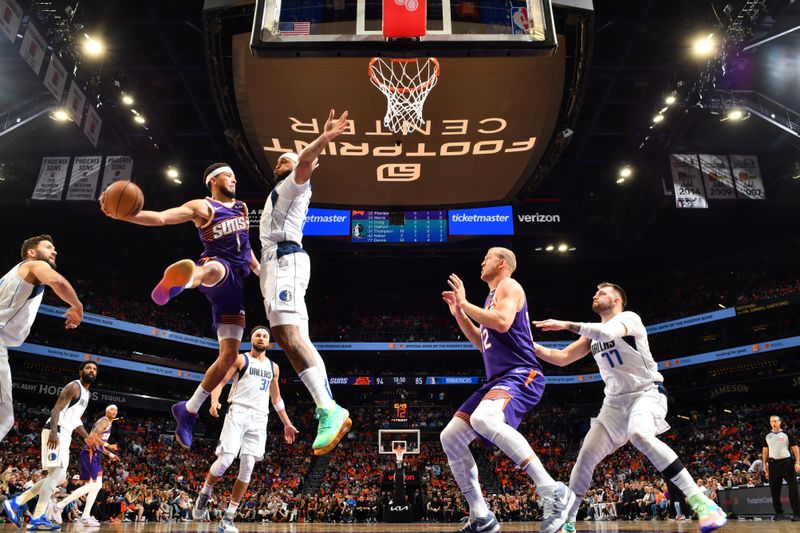 PHOENIX, AZ - OCTOBER 26: Devin Booker #1 of the Phoenix Suns passes the ball during the game against the Dallas Mavericks on October 26, 2024 at Footprint Center in Phoenix, Arizona. NOTE TO USER: User expressly acknowledges and agrees that, by downloading and or using this photograph, user is consenting to the terms and conditions of the Getty Images License Agreement. Mandatory Copyright Notice: Copyright 2024 NBAE (Photo by Barry Gossage/NBAE via Getty Images)