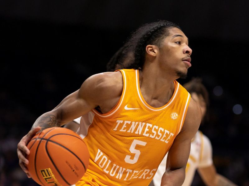 Jan 21, 2023; Baton Rouge, Louisiana, USA;  Tennessee Volunteers guard Zakai Zeigler (5) dribbles the ball against the LSU Tigers during the second half at Pete Maravich Assembly Center. Mandatory Credit: Stephen Lew-USA TODAY Sports