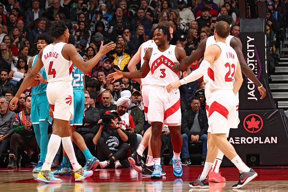 TORONTO, CANADA - DECEMBER 18:  OG Anunoby #3 of the Toronto Raptors is congratulated during the game against the Charlotte Hornets on December 18, 2023 at the Scotiabank Arena in Toronto, Ontario, Canada.  NOTE TO USER: User expressly acknowledges and agrees that, by downloading and or using this Photograph, user is consenting to the terms and conditions of the Getty Images License Agreement.  Mandatory Copyright Notice: Copyright 2023 NBAE (Photo by Vaughn Ridley/NBAE via Getty Images)