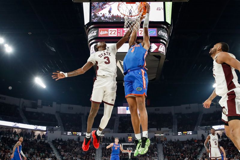 Feb 11, 2025; Starkville, Mississippi, USA; Florida Gators forward Sam Alexis (4) shoots as Mississippi State Bulldogs forward KeShawn Murphy (3) defends during the first half at Humphrey Coliseum. Mandatory Credit: Wesley Hale-Imagn Images