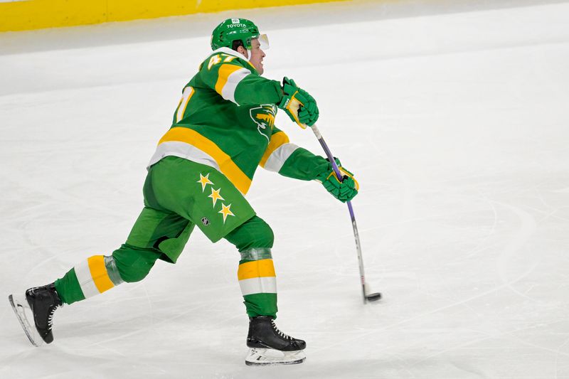 Feb 17, 2024; Saint Paul, Minnesota, USA;  Minnesota Wild defenseman Declan Chisholm (47) scores a power play goal against the Buffalo Sabres during the third period at Xcel Energy Center. Mandatory Credit: Nick Wosika-USA TODAY Sports