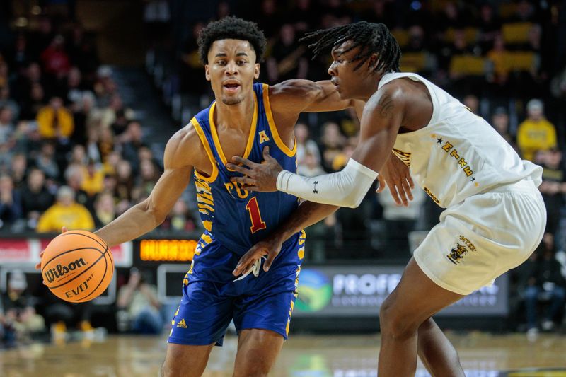 Jan 14, 2023; Wichita, Kansas, USA; Tulsa Golden Hurricane guard Sam Griffin (1) drives to the basket during the first half against the Wichita State Shockers  at Charles Koch Arena. Mandatory Credit: William Purnell-USA TODAY Sports