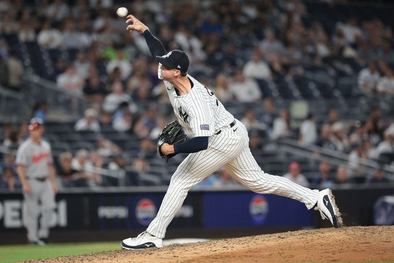 Jun 18, 2024; Bronx, New York, USA; New York Yankees relief pitcher Clay Holmes (35) delivers a pitch during the ninth inning against the Baltimore Orioles at Yankee Stadium. Mandatory Credit: Vincent Carchietta-USA TODAY Sports