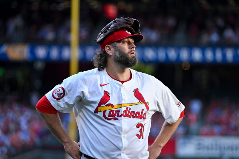 Jun 24, 2024; St. Louis, Missouri, USA;  St. Louis Cardinals starting pitcher Lance Lynn (31) looks on as he walks off the field after the second inning against the Atlanta Braves at Busch Stadium. Mandatory Credit: Jeff Curry-USA TODAY Sports