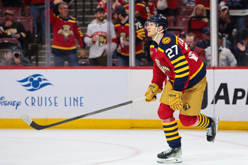 Feb 4, 2026; Sunrise, Florida, USA; Florida Panthers center Eetu Luostarinen (27) looks on after scoring against the Boston Bruins during the first period at Amerant Bank Arena. Mandatory Credit: Sam Navarro-Imagn Images