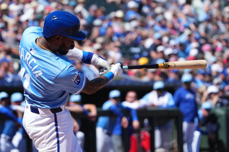 Mar 13, 2024; Surprise, Arizona, USA; Kansas City Royals third baseman Maikel Garcia (11) bats against the Los Angeles Angels during the first inning at Surprise Stadium. Mandatory Credit: Joe Camporeale-USA TODAY Sports