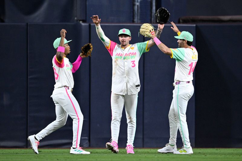 Jun 21, 2024; San Diego, California, USA; San Diego Padres center fielder Jackson Merrill (3) celebrates on the field with left fielder Jose Azocar (28) and right fielder Tyler Wade (14) after defeating the Milwaukee Brewers at Petco Park. Mandatory Credit: Orlando Ramirez-USA TODAY Sports
