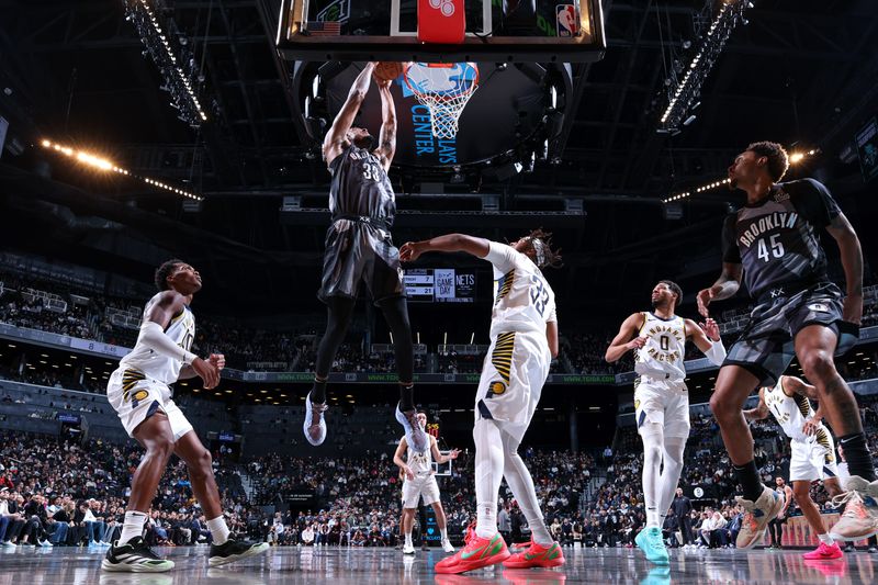 BROOKLYN, NY - DECEMBER 4: Nicolas Claxton #33 of the Brooklyn Nets dunks the ball during the game against the Indiana Pacers on December 4, 2024 at Barclays Center in Brooklyn, New York. NOTE TO USER: User expressly acknowledges and agrees that, by downloading and or using this Photograph, user is consenting to the terms and conditions of the Getty Images License Agreement. Mandatory Copyright Notice: Copyright 2024 NBAE (Photo by Jeff Haynes/NBAE via Getty Images)