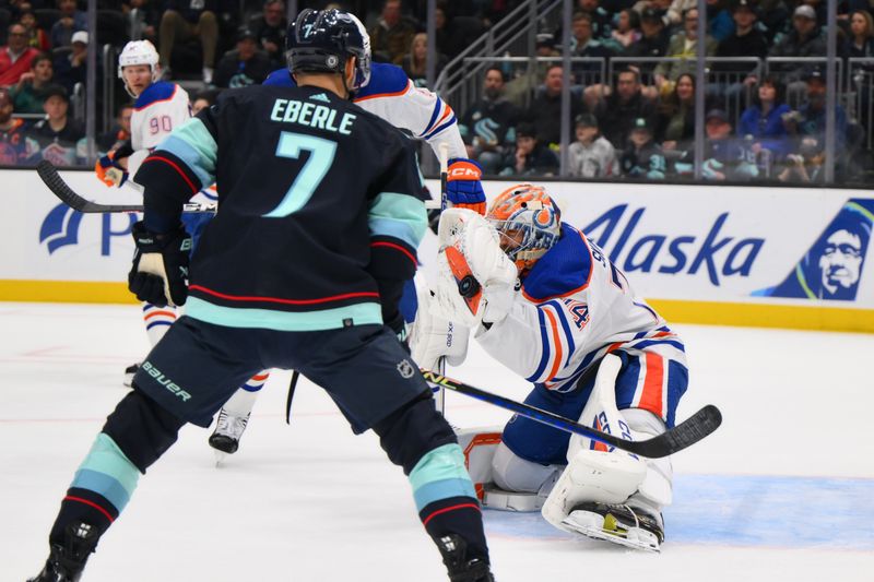 Mar 2, 2024; Seattle, Washington, USA; Edmonton Oilers goaltender Stuart Skinner (74) blocks a goal shot against the Seattle Kraken during the second period at Climate Pledge Arena. Mandatory Credit: Steven Bisig-USA TODAY Sports