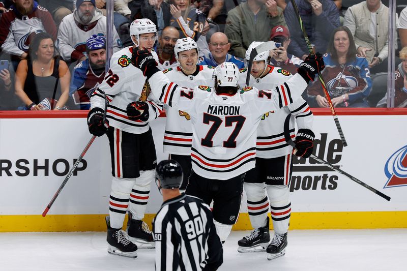 Oct 28, 2024; Denver, Colorado, USA; Chicago Blackhawks center Philipp Kurashev (23) celebrates his goal with left wing Patrick Maroon (77) and defenseman Alex Vlasic (72) and center Craig Smith (15) in the first period against the Colorado Avalanche at Ball Arena. Mandatory Credit: Isaiah J. Downing-Imagn Images