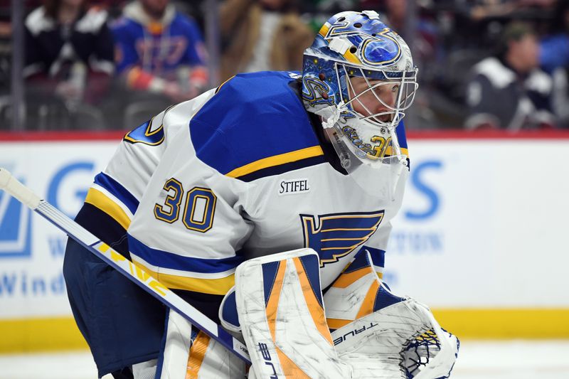 Jan 31, 2025; Denver, Colorado, USA; St. Louis Blues goaltender Joel Hofer (30) waits for a face off during the second period against the Colorado Avalanche at Ball Arena. Mandatory Credit: Christopher Hanewinckel-Imagn Images