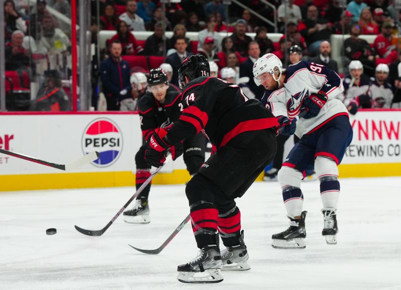 Apr 7, 2024; Raleigh, North Carolina, USA;  Columbus Blue Jackets left wing Alexander Nylander (92) gets the shot away against the Carolina Hurricanes during the second period at PNC Arena. Mandatory Credit: James Guillory-USA TODAY Sports