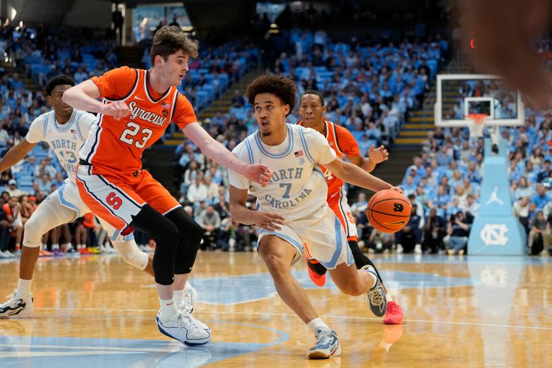 Jan 13, 2024; Chapel Hill, North Carolina, USA;  North Carolina Tar Heels guard Seth Trimble (7) with the ball as Syracuse Orange center Peter Carey (23) defends in the second half at Dean E. Smith Center. Mandatory Credit: Bob Donnan-USA TODAY Sports