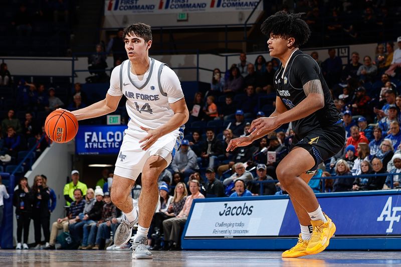 Mar 4, 2023; Colorado Springs, Colorado, USA; Air Force Falcons forward Beau Becker (14) controls the ball as San Jose State Spartans forward Robert Vaihola (22) guards in the second half at Clune Arena. Mandatory Credit: Isaiah J. Downing-USA TODAY Sports