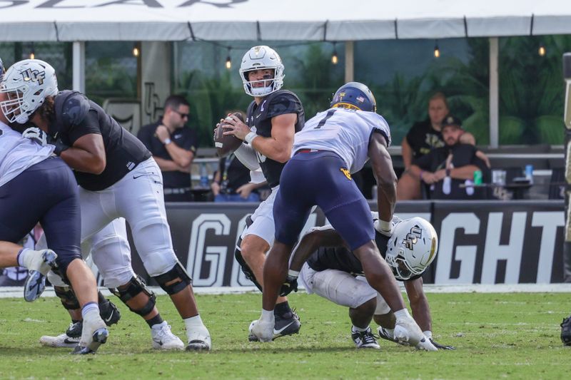 Oct 28, 2023; Orlando, Florida, USA; UCF Knights quarterback John Rhys Plumlee (10) looks to pass during the second half against the West Virginia Mountaineers at FBC Mortgage Stadium. Mandatory Credit: Mike Watters-USA TODAY Sports